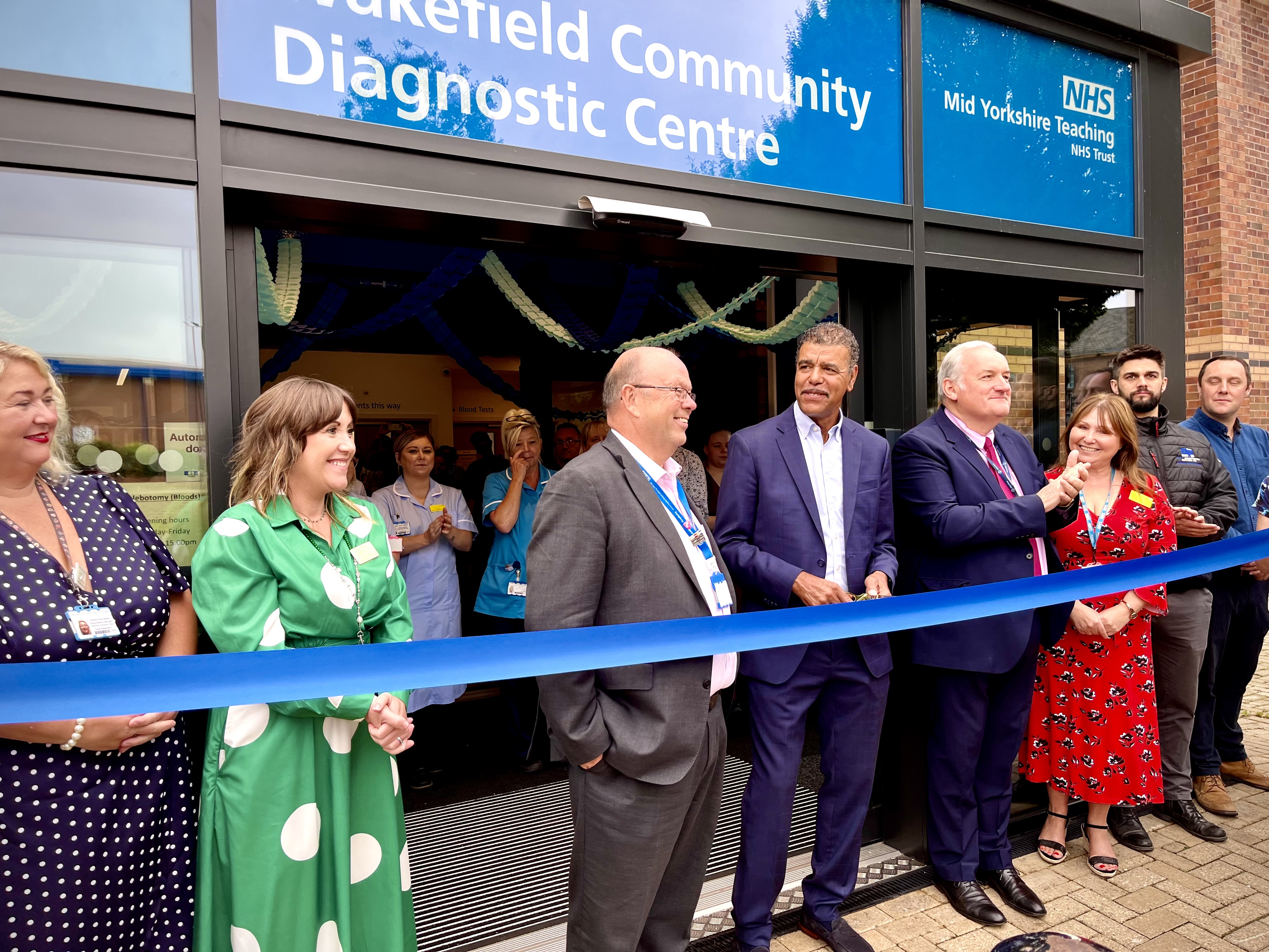 photo of Wakefield CDC featuring the project team plus Chris Kamara, Len Richards and Keith Ramsay