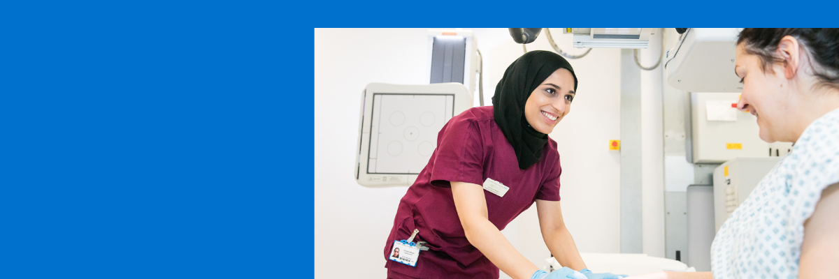Radiographer caring for a patient before their scan